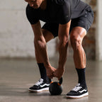 Unconditional Active Peacemaker 5-inch athletic shorts shown on a model, featuring a comfortable fit and sporty design.