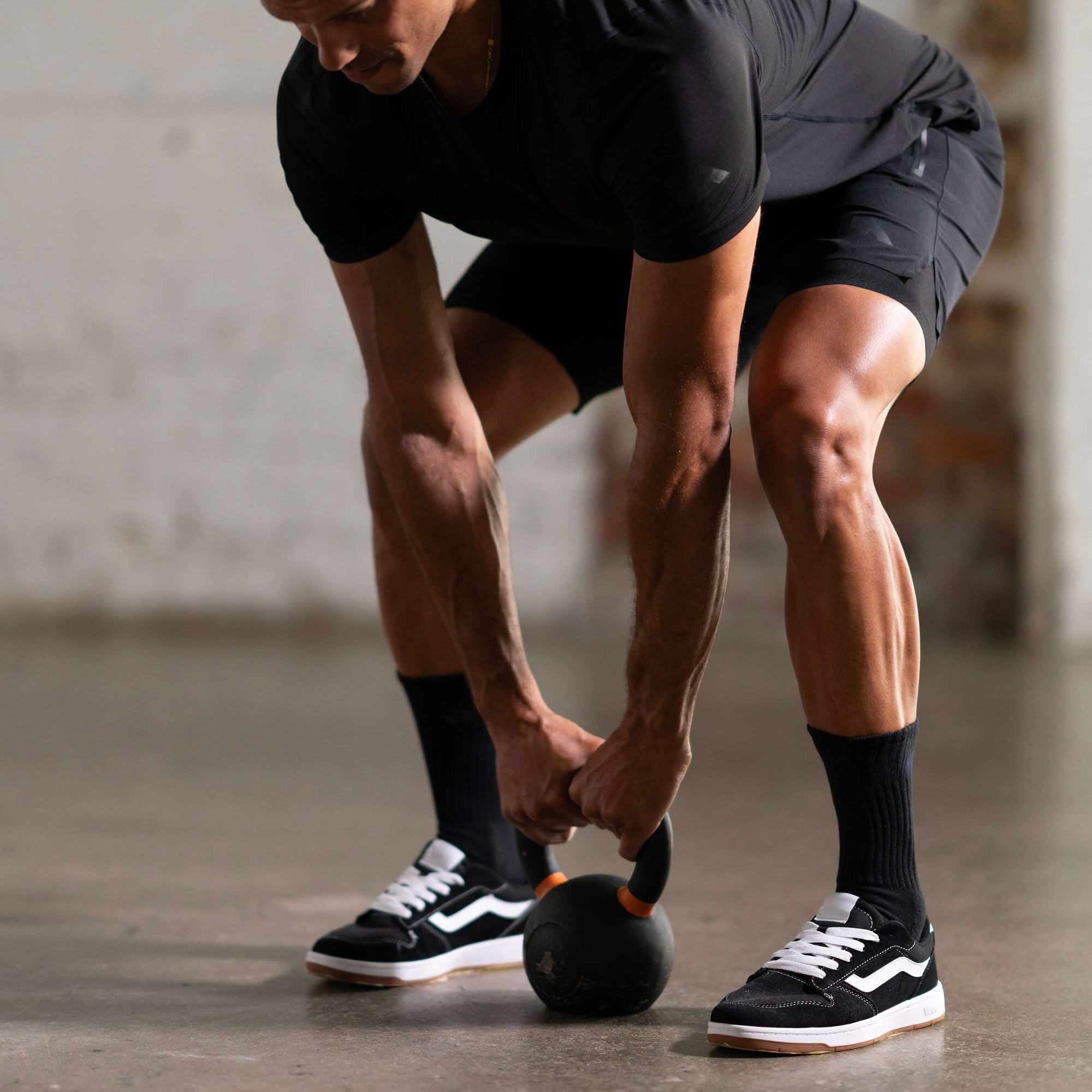 Unconditional Active Peacemaker 5-inch athletic shorts shown on a model, featuring a comfortable fit and sporty design.