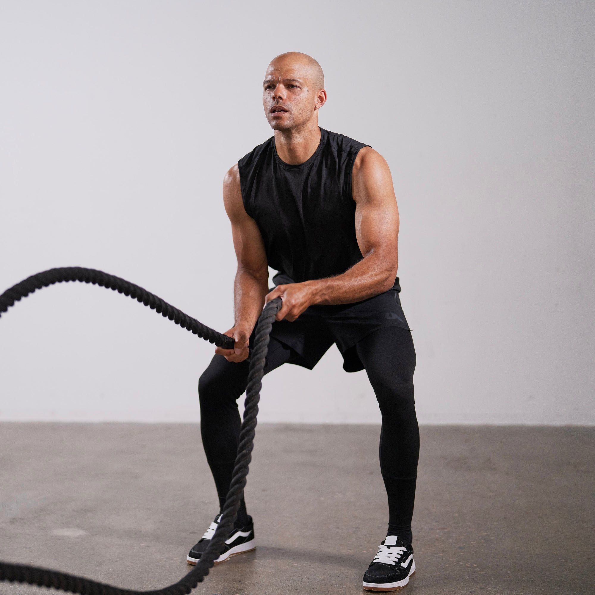 Unconditional Active Darkside Muscle Tank top in black with sleeveless design and athletic fit for active wear.