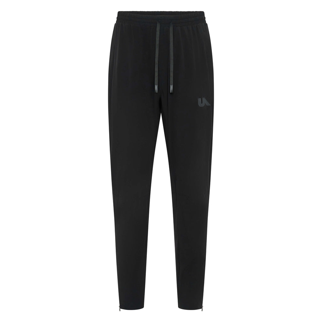 Black Unconditional Active Maverick Session Pant trackpants laid flat showing comfortable fit and elastic waistband.