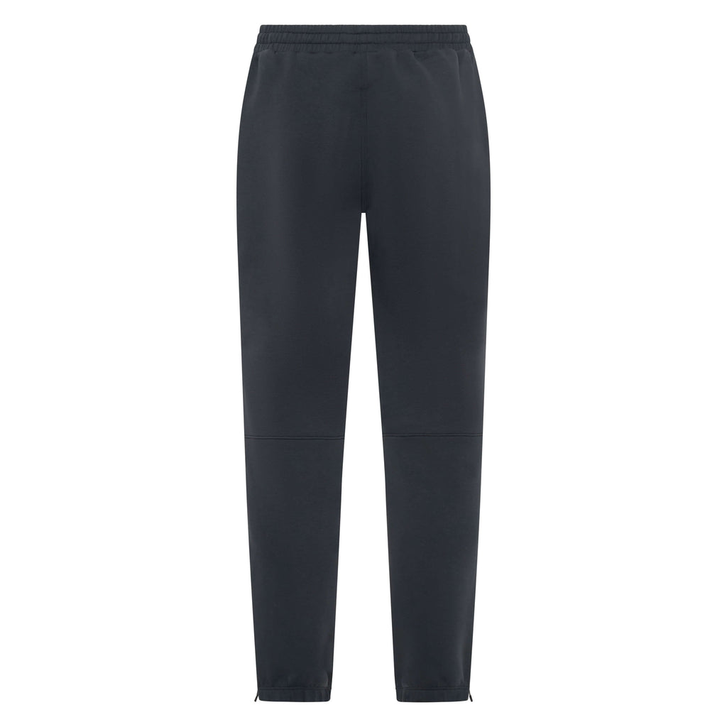 Dark charcoal Unconditional Active Onslaught Everywhere track pants laid flat, showing elastic waistband and tapered fit.