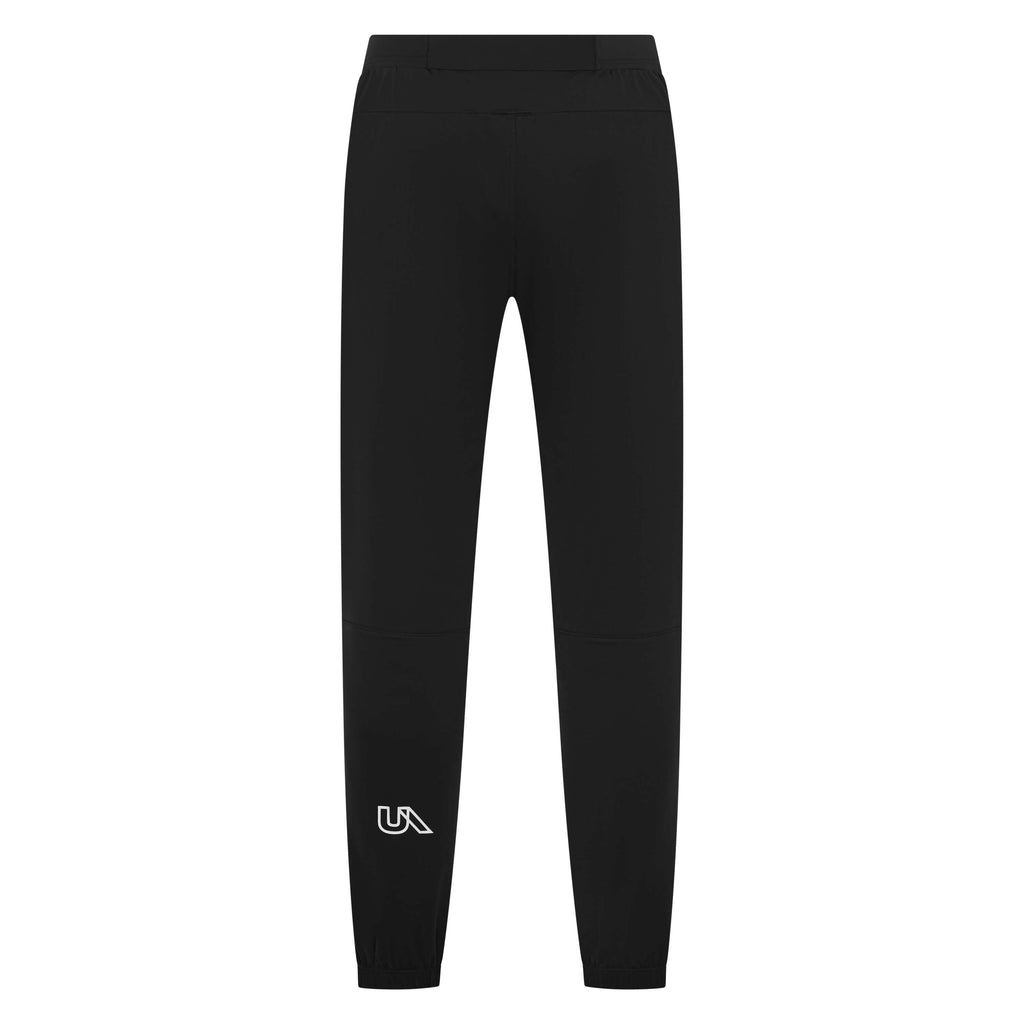 Black Warlock Long Jogger trackpants by Unconditional Active with elastic waistband and tapered fit, shown on a person.