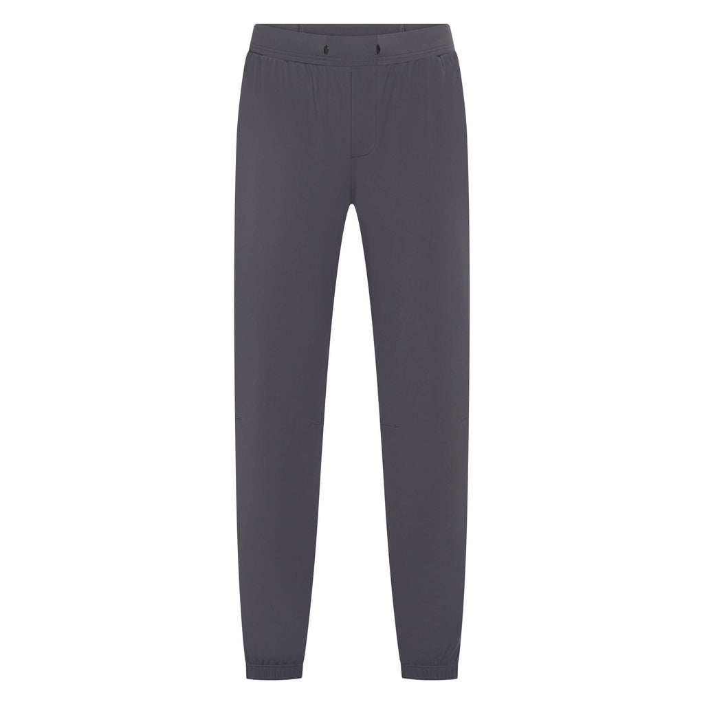 Unconditional Active Warlock Long Jogger trackpants in dark charcoal, featuring a relaxed fit with elastic waistband and tapered design.